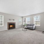 Spacious Living Room With Fireplace And Balcony