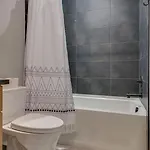 Holiday home Stylish 4bed Retreat With Rooftop, Garage, Peloton, Sleeps 12, Fire Table, Gourmet Kitchen, Cozy Living Space, Dedicated Parking, Near Distilleries, Marathon Village And Nightlife, Chic Skyline Views, 24 Hour Hospitality *